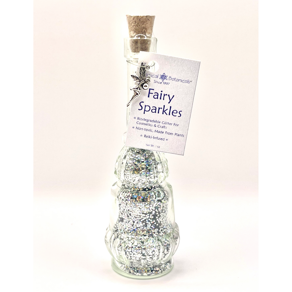Bottle labeled 'Fairy Sparkles' with glittery contents on a white background