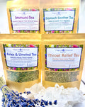 Four packages of herbal tea with labels on a white background