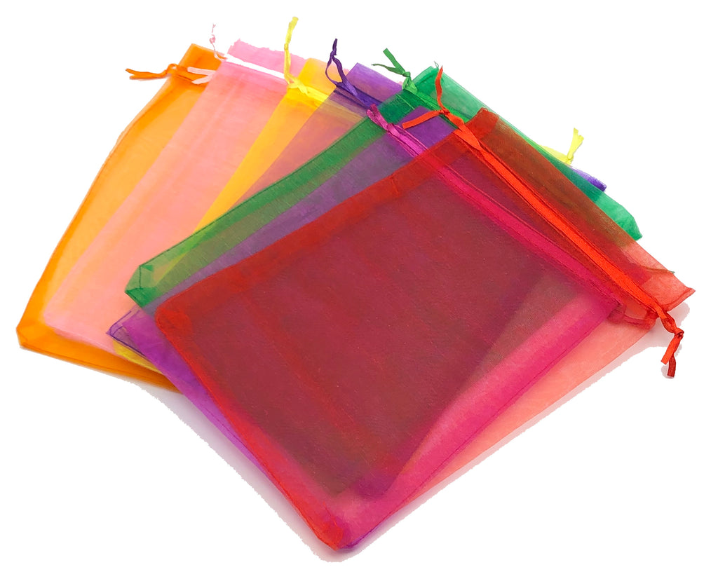 Set of colorful transparent drawstring bags on a white background